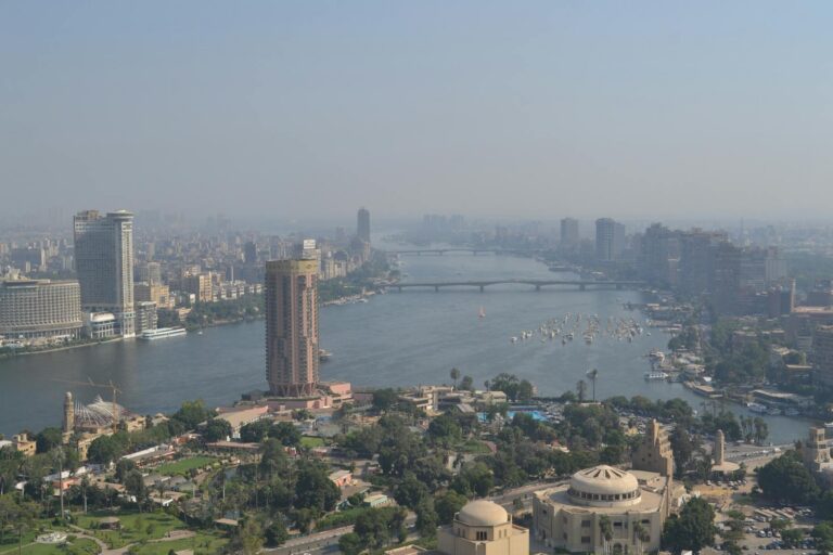Aerial view of Cairo cityscape with the Nile River running through the center