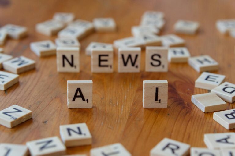 Scrabble letters arranged to spell AI-related terms on a flat surface