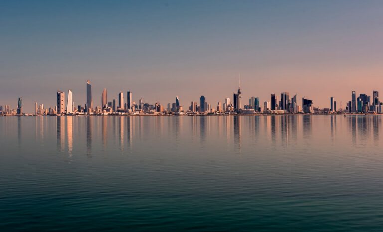 A coastal city skyline viewed along the waterfront during daytime