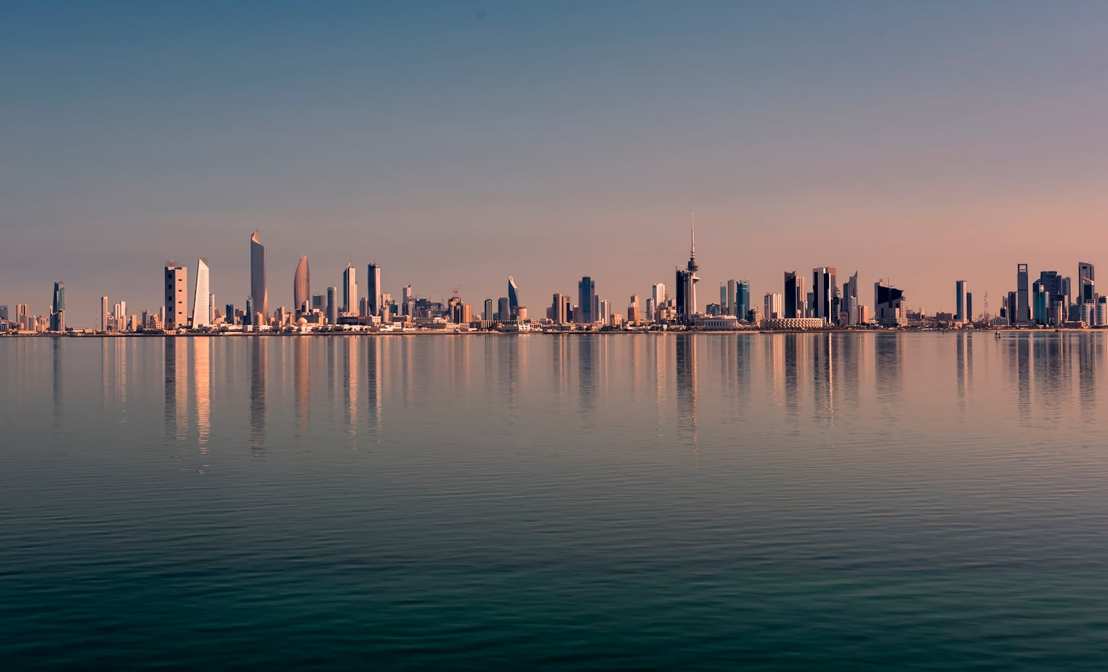 A coastal city skyline viewed along the waterfront during daytime