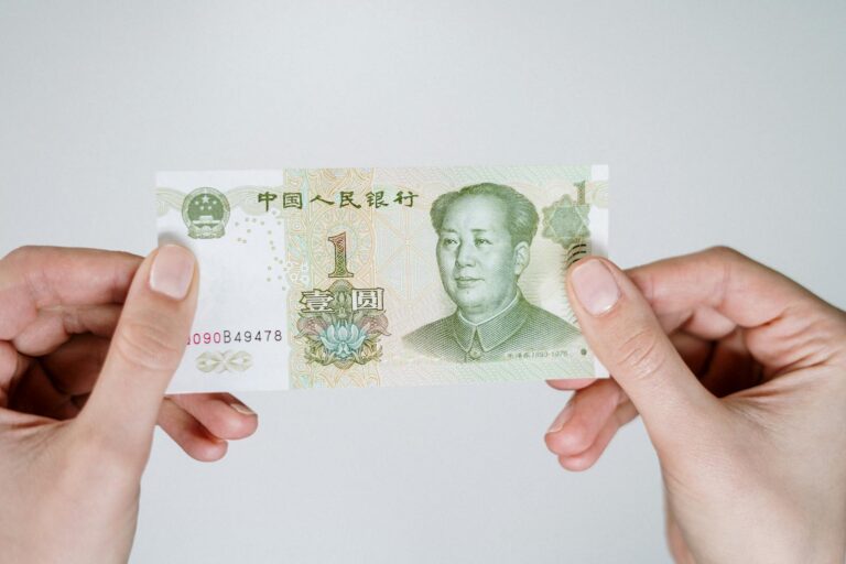 Chinese yuan banknote photographed on a white table