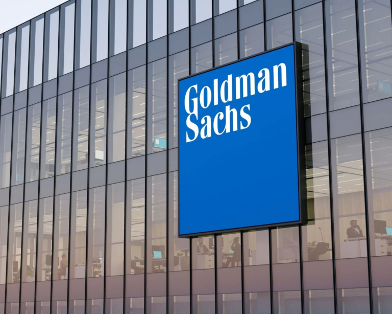The Goldman Sachs logo on the glass facade of an office building, US