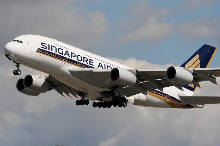 Singapore Airlines Airbus A380 climbing after take off with its landing gear extended, Singapore