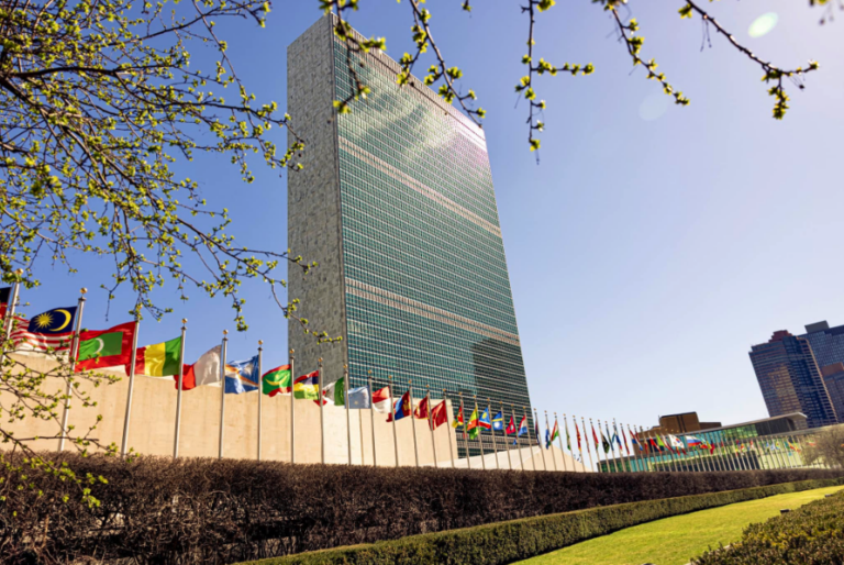 United Nations Headquarters, New York, USA: the Secretariat tower behind the line of member state flags