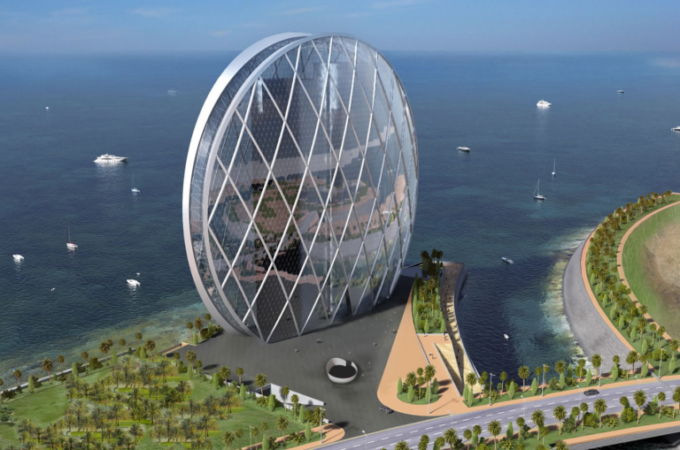 The circular glass Aldar headquarters building on the Abu Dhabi waterfront, UAE