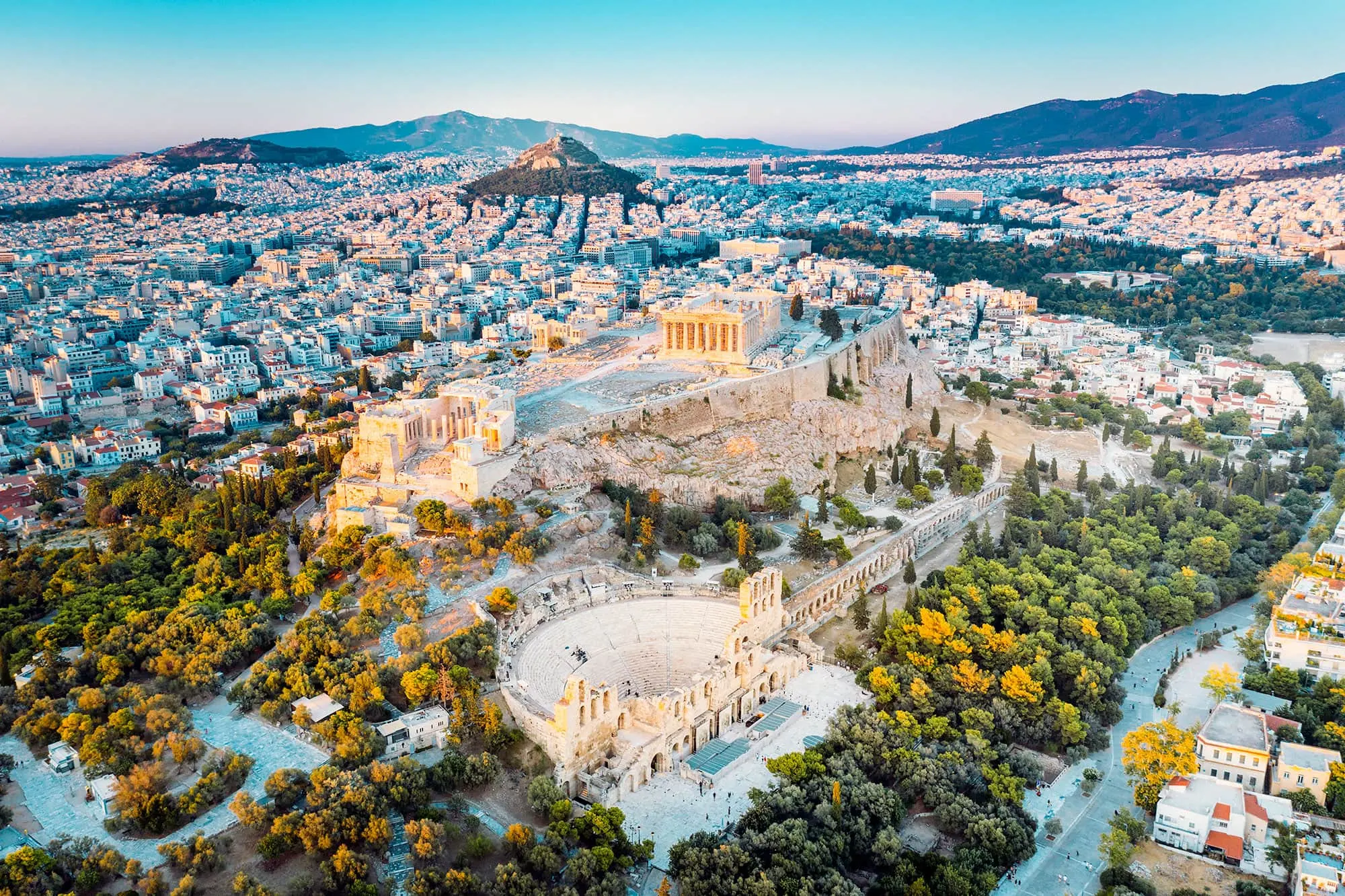 Aerial view of the Acropolis of Athens with the Parthenon and the Odeon of Herodes Atticus above the city, with Lycabettus Hill behind