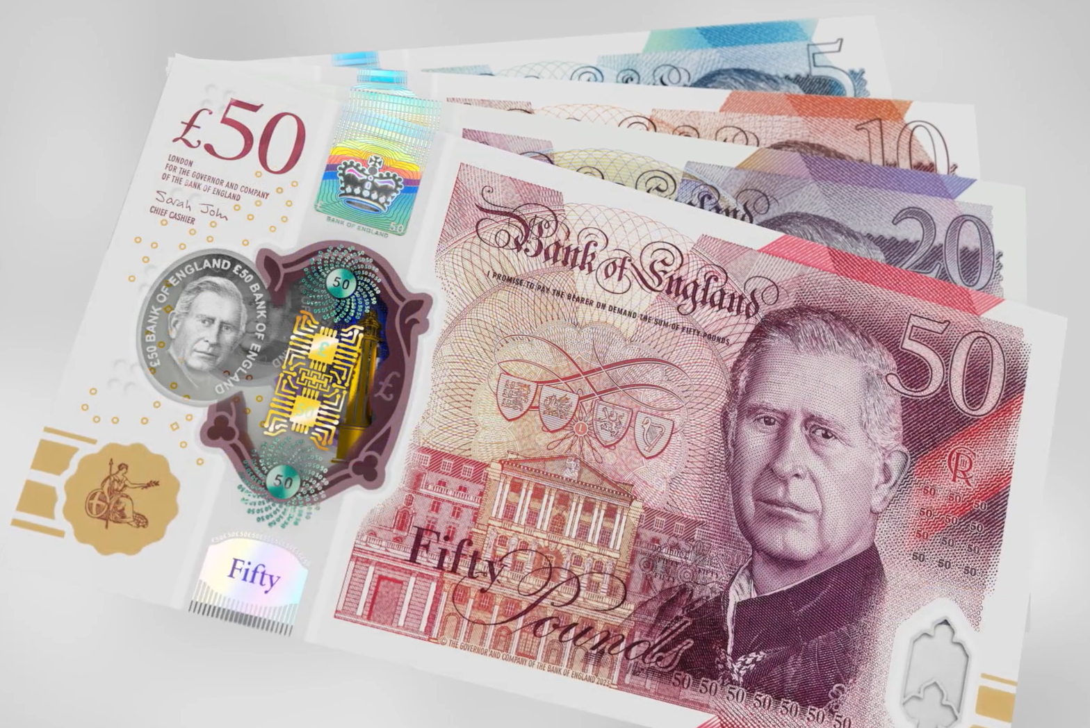 Fanned Bank of England polymer banknotes of 5, 10, 20 and 50 pounds, with the 50 pound note bearing the portrait of King Charles III at the front