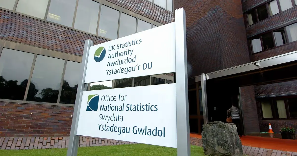 Signs of the UK Statistics Authority and the Office for National Statistics, in English and Welsh, outside an ONS office building
