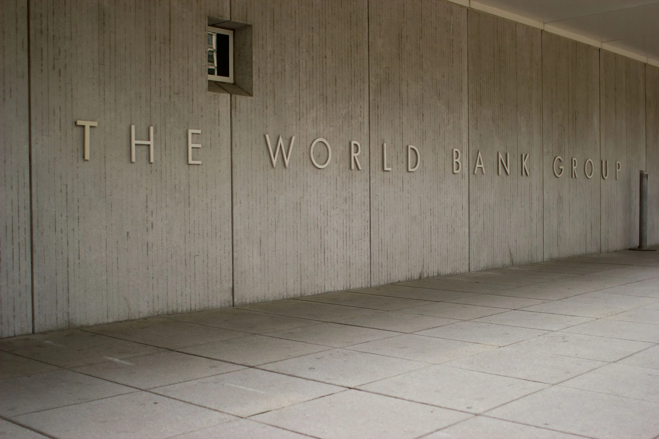 The World Bank Group name in raised letters on the concrete wall of its headquarters building in Washington